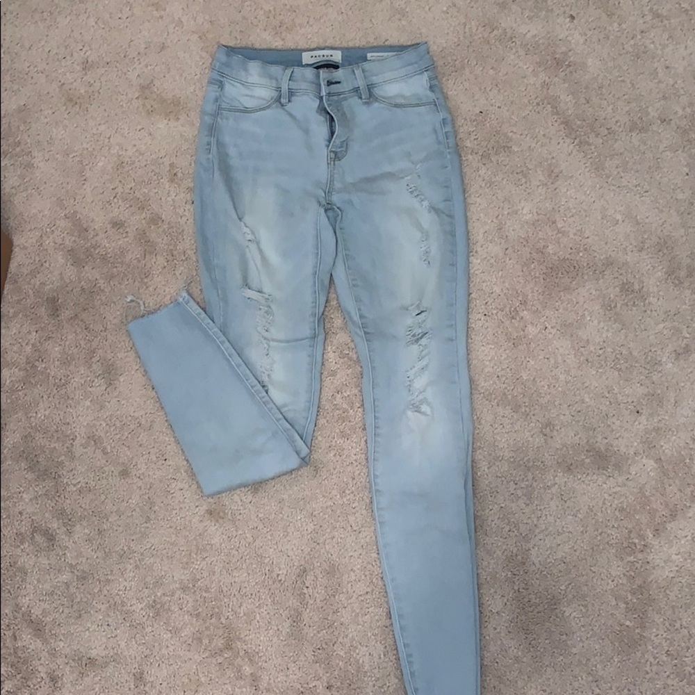 Light colored ripped jeans